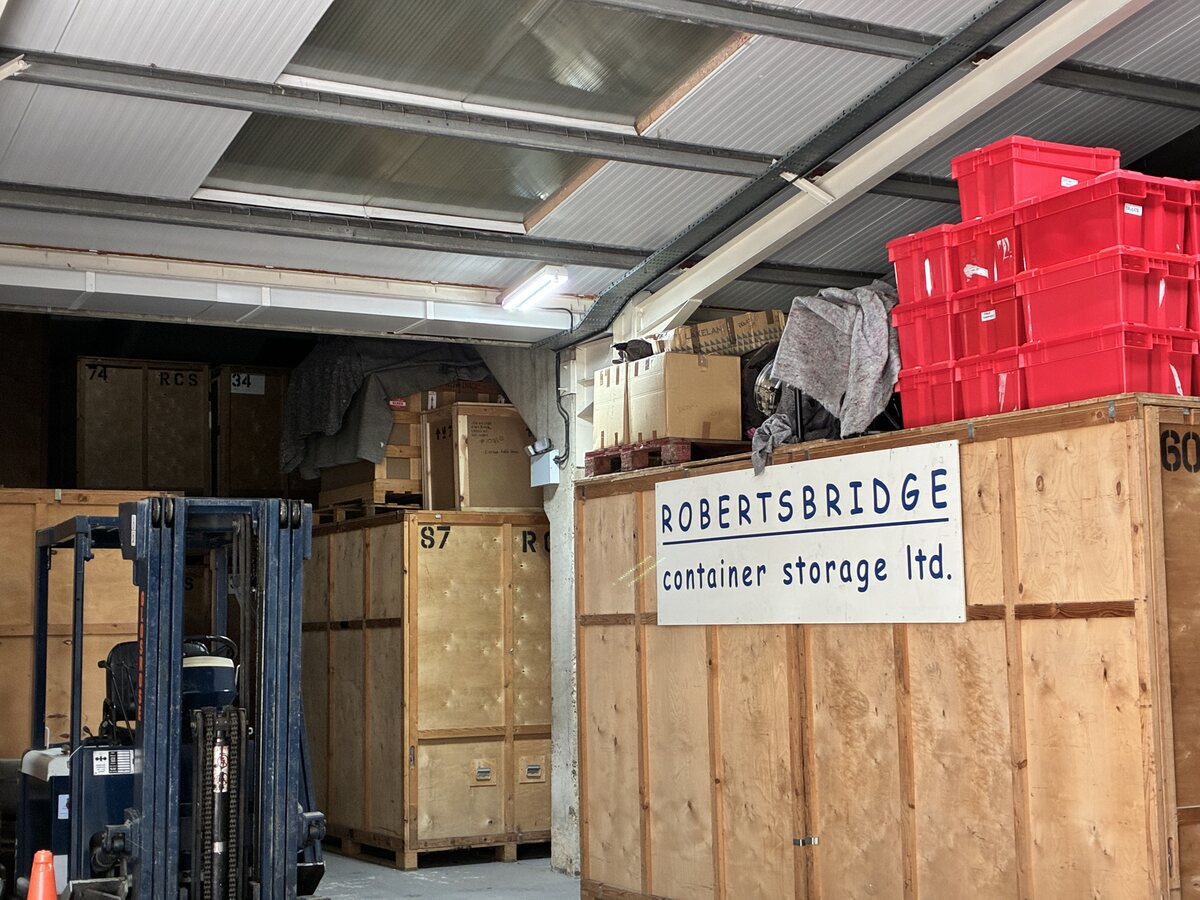 Wooden storage units and handling equipment inside the RCS warehouse