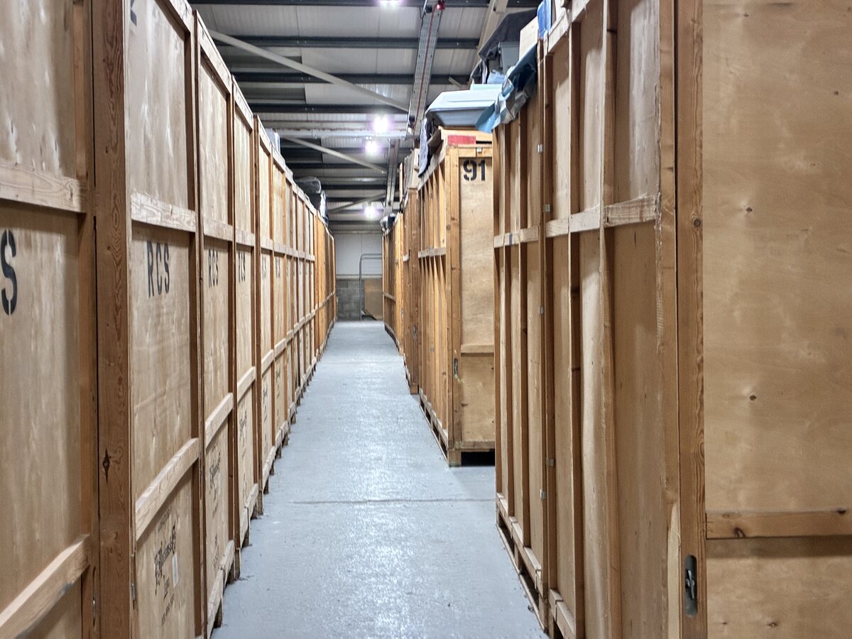 Individual wooden storage units inside the RCS warehouse