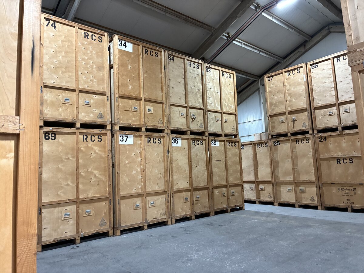 Wooden storage units stacked securely inside the RCS warehouse